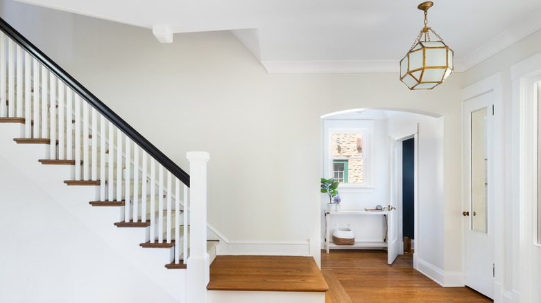 bright home with wooden staircase