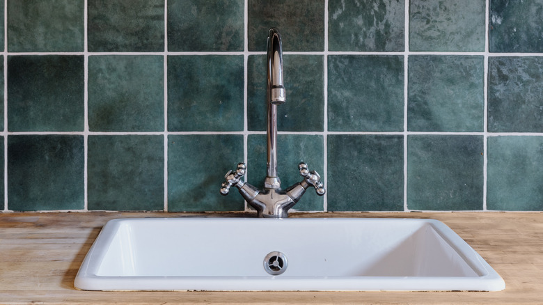 Green tiles in kitchen