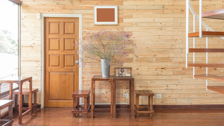 A room with a reclaimed wood wall