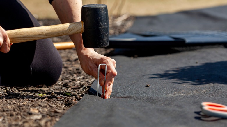 Installing landscaping fabric