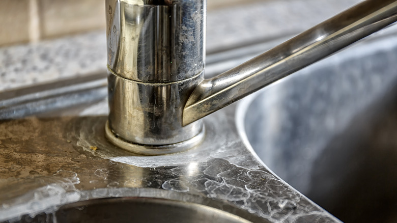 Close up of kitchen sink with hard water stains