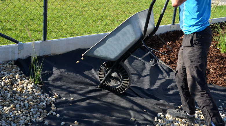 Adding gravel to garden bed
