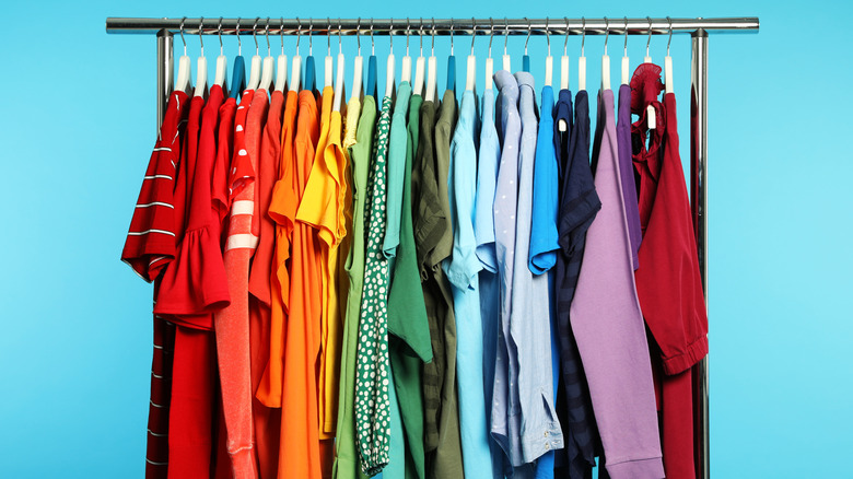 Colorful clothes on metal rack