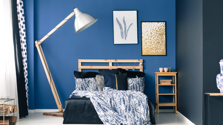 blue accent wall in bedroom