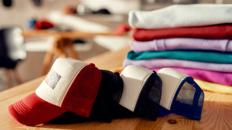 A pile of hats on a table