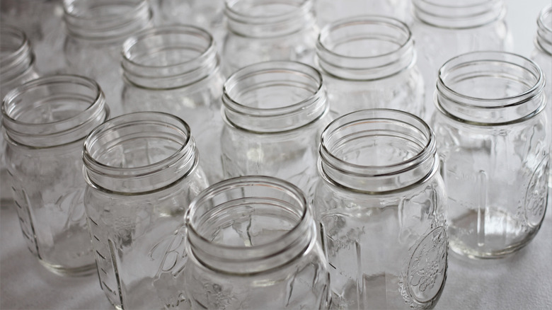 Empty Mason jars on white countertop