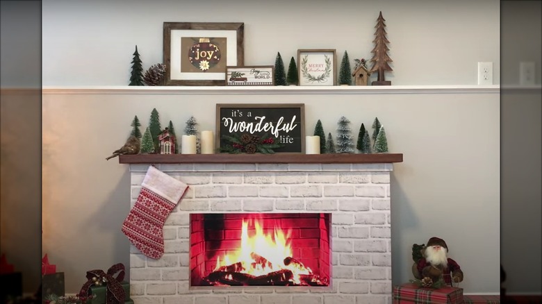 Room with a faux fireplace made from foam, an old TV, and foam board