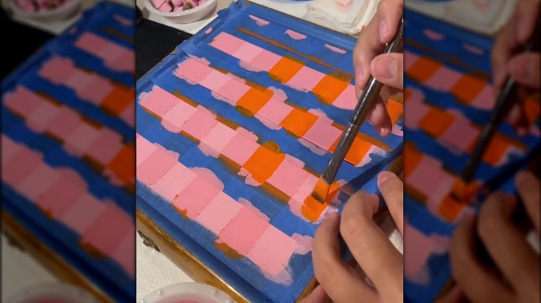 Painting a chessboard pink and orange