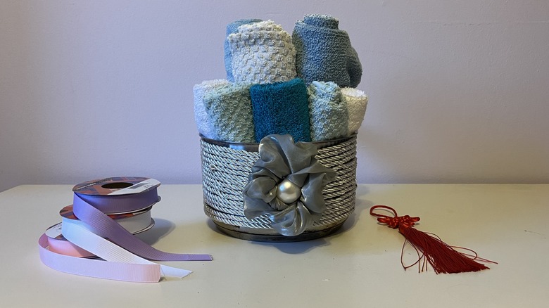 Towel basket with tassel and ribbons