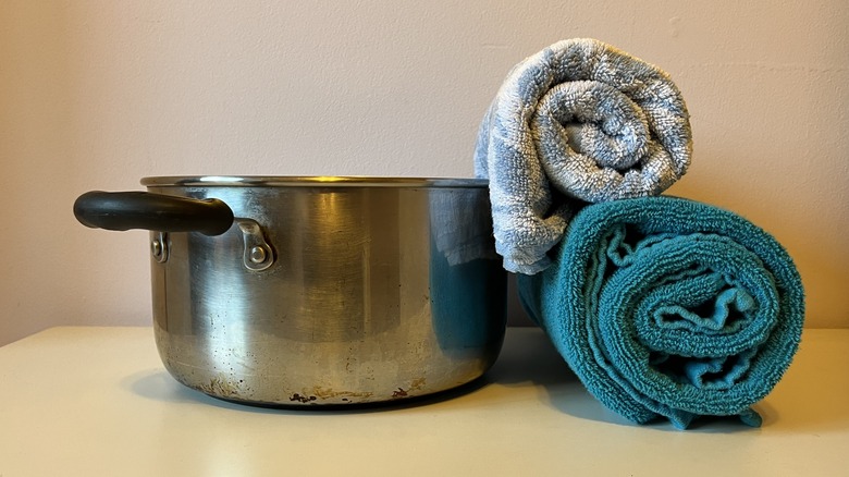 Metal pot and two towels