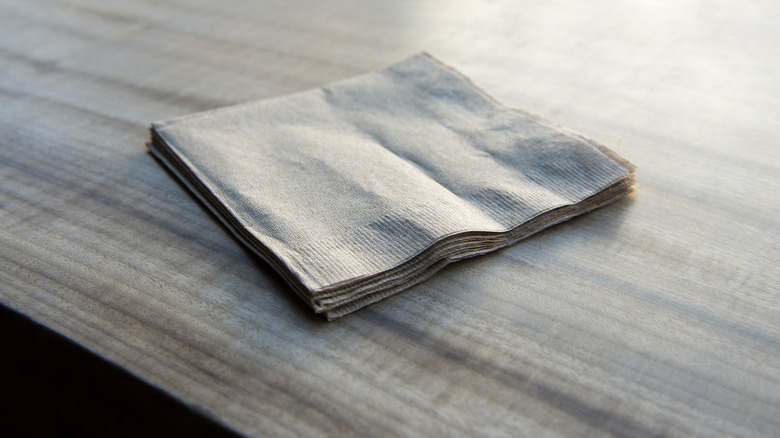 napkins laying on wood surface