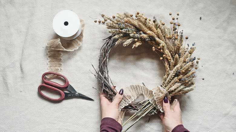 Person making DIY wreath