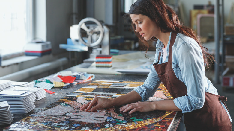 A woman making mosaic