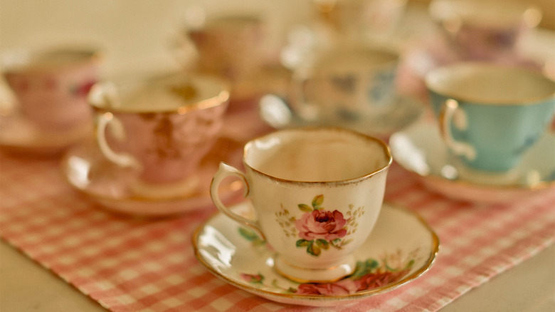 A collection of floral pink and white teacups