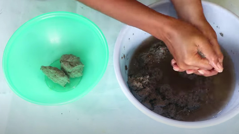 Making egg carton clay balls