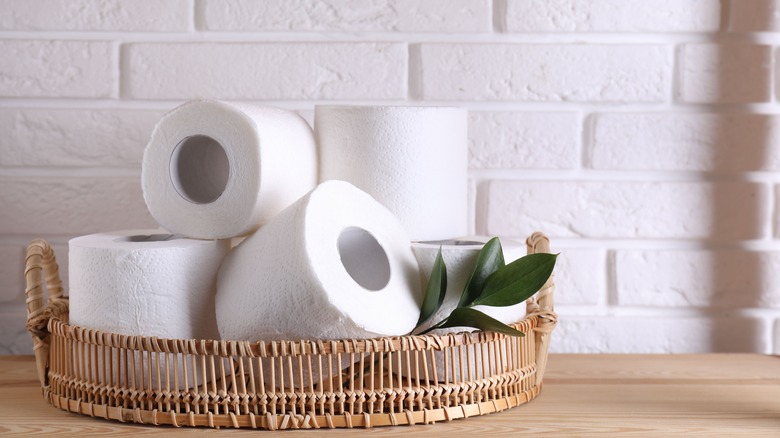 Toilet paper in wicker basket