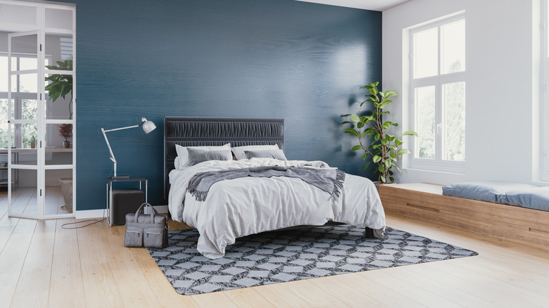 blue bedroom with staged bed