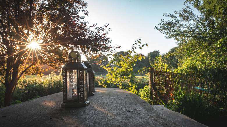 Camping lanterns on table in garden