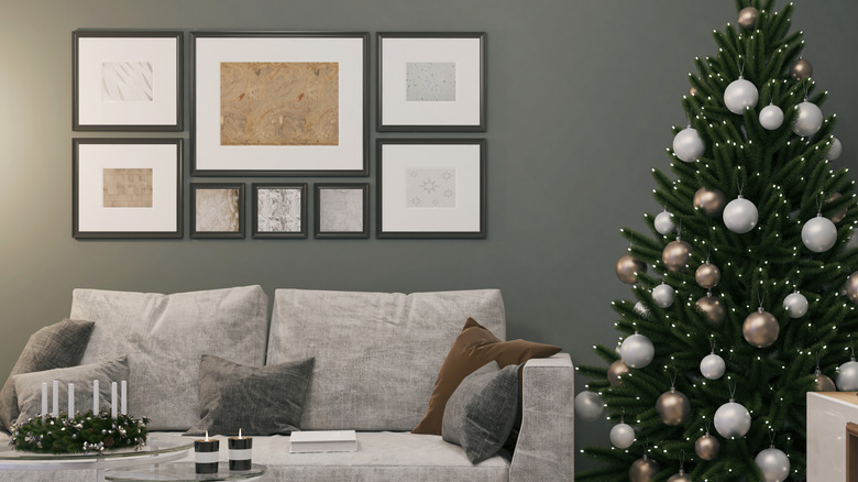 Living room with a Christmas tree and framed artwork on the wall