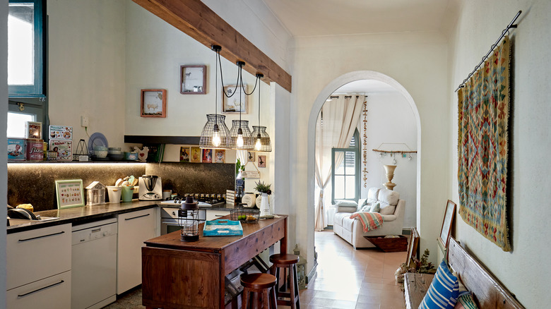 Kitchen with arched doorway into living area