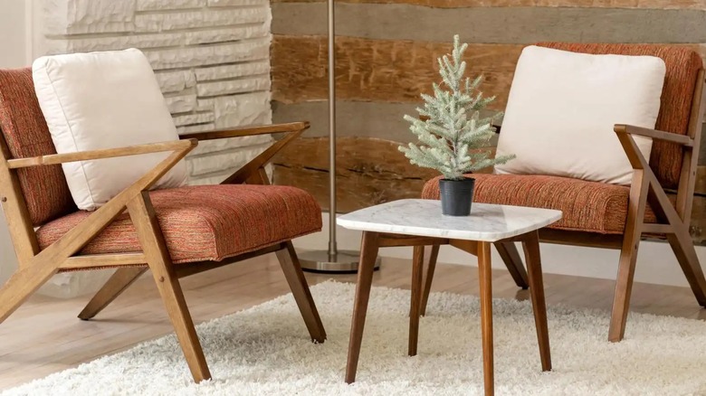 White textured rug paired with brown, textured, upholstered chairs