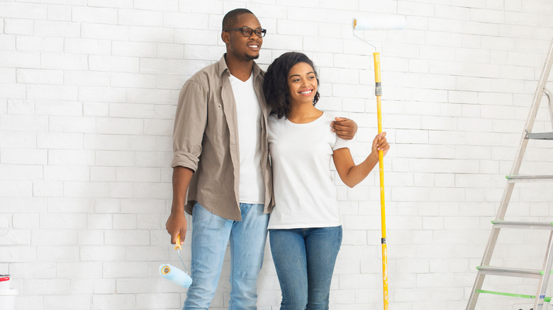 Couple getting ready to paint room