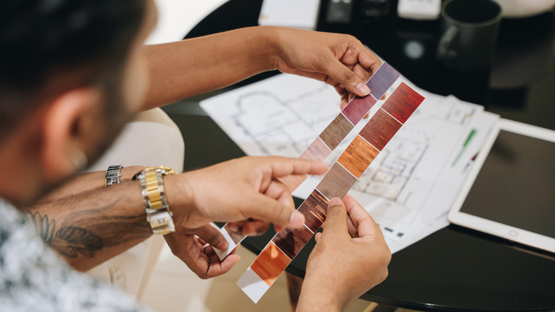 Couple choosing materials for home