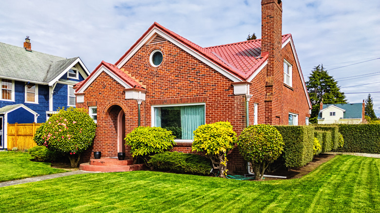 Brick house with green lawn