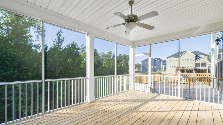 New light wood and white porch with ceiling fan