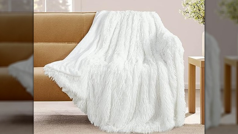 White blanket draped over couch