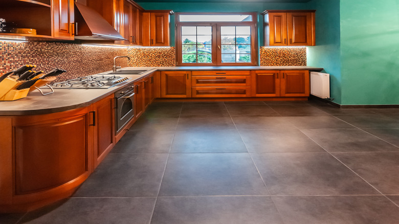 A green painted ceiling with a lighting fixture in the kitchen