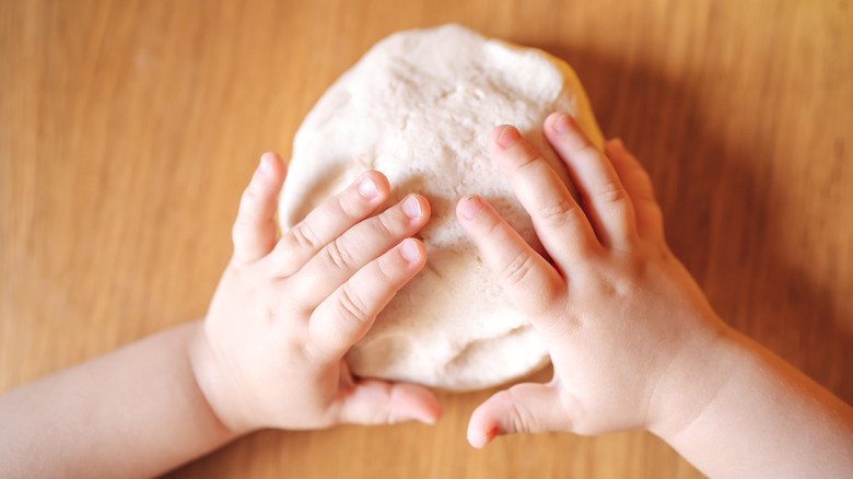 child with homemade playdough