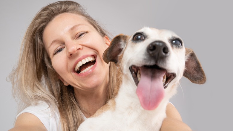 Smiling woman and dog