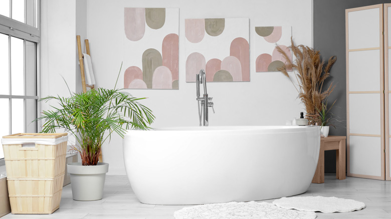 Simple bathroom with artwork on the wall