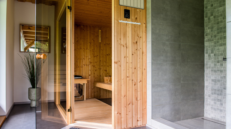 Wood indoor sauna inside a modern bathroom