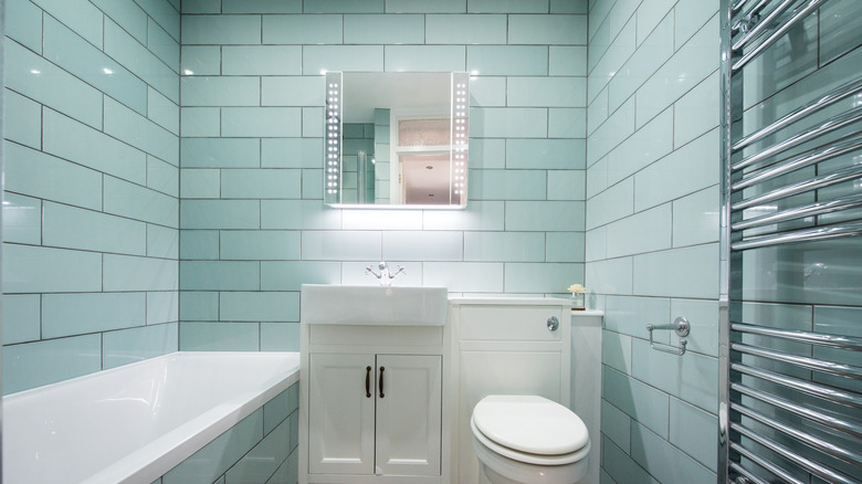 Bathroom with matching tile across walls and floors