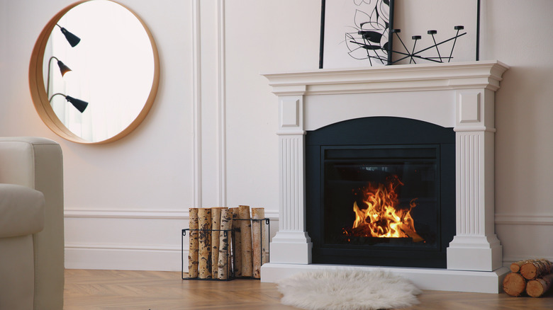 Mirror next to fireplace mantle 