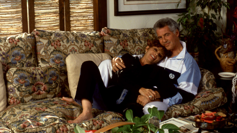 Jed and Toby Allan lounge on sofa in 90s