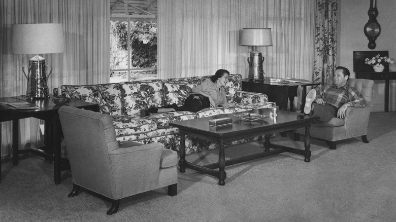 Brenda Marshall reclines on a sofa in the 50s