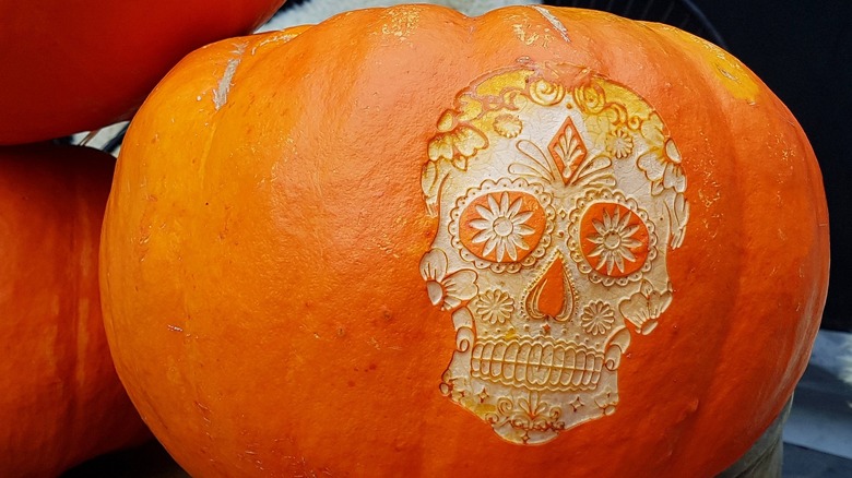 pumpkin with etched calavera skull