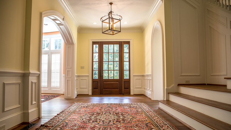 entryway with hanging light