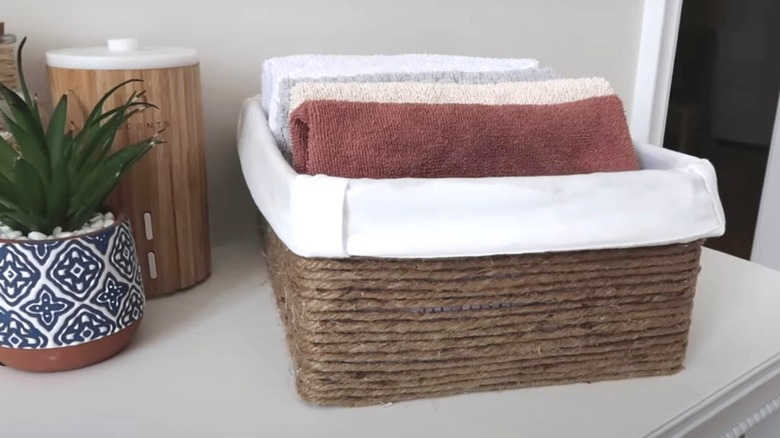 shoebox storage basket with towels