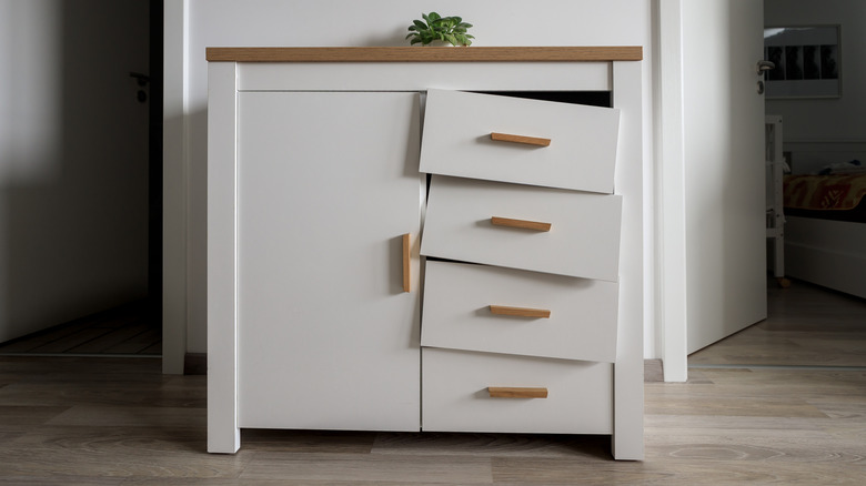 New cabinet with defective or incorrectly installed drawers