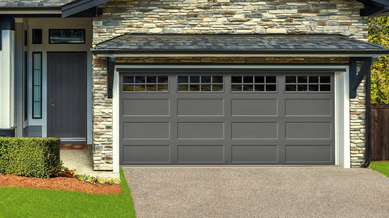 A house with a recessed steel garage door from Ideal Garage Door