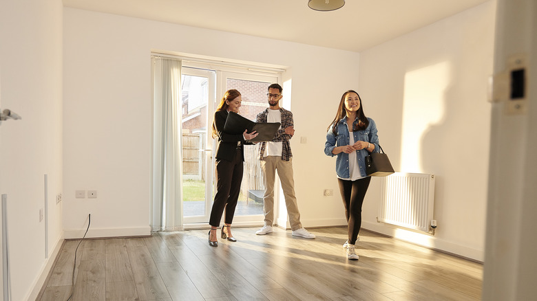 Estate agent showing off house