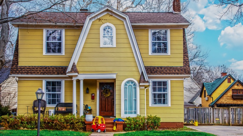 yellow two-story house