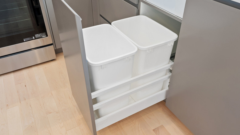 Trash bins located inside a kitchen in a house