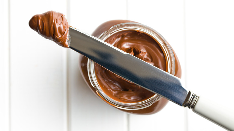 knife balancing on Nutella jar