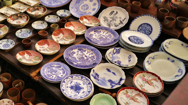 Decorative plates displayed on table for sale