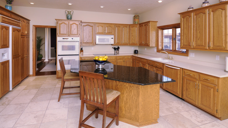 Large kitchen with outdated oak cabinets